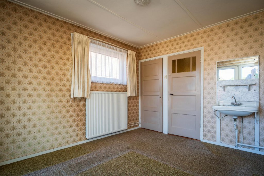 Tussenwoning te koop: Wilhelminalaan 84, Den Burg