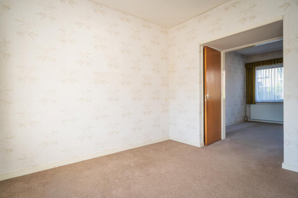Tussenwoning te koop: Wilhelminalaan 84, Den Burg