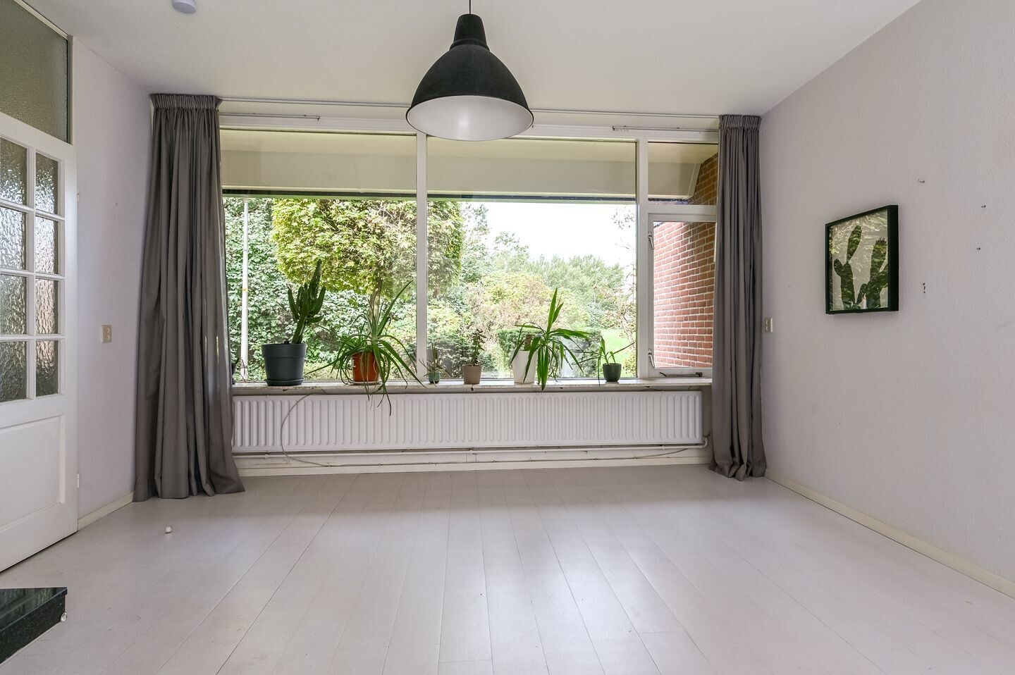 Tussenwoning te koop: Minister van Houtenlaan 4, Velsen-Zuid