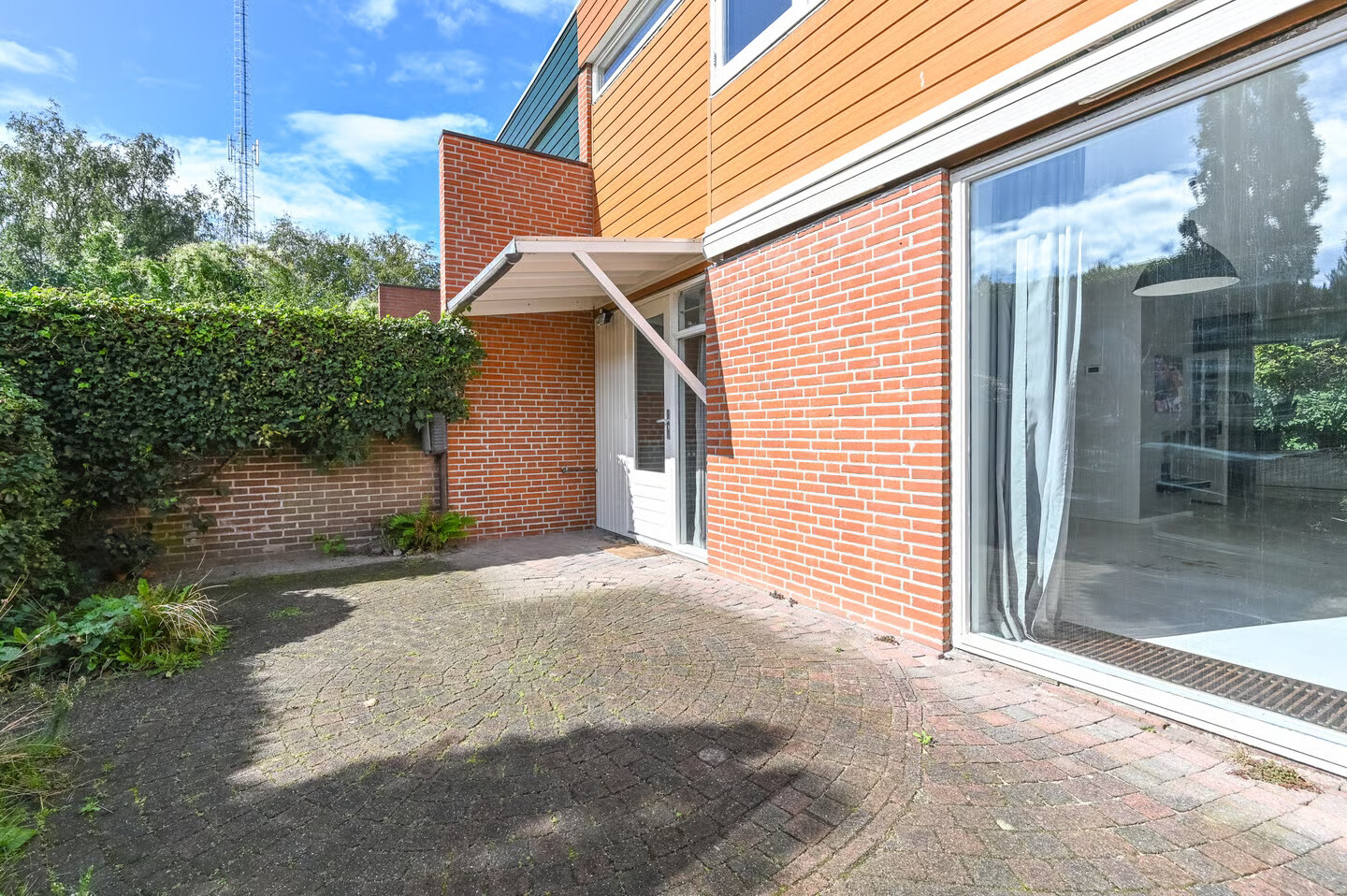 Tussenwoning te koop: Minister van Houtenlaan 4, Velsen-Zuid