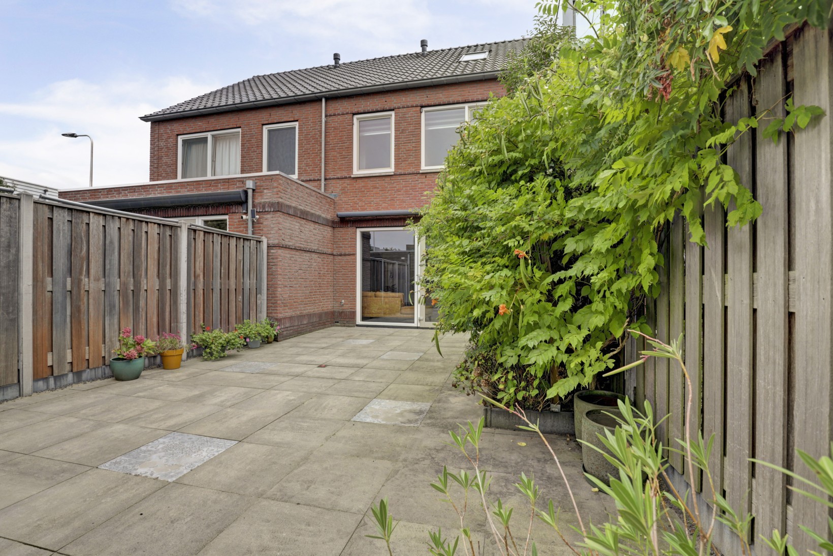 Tussenwoning te koop: Baas en Domburgstraat 61, Bodegraven
