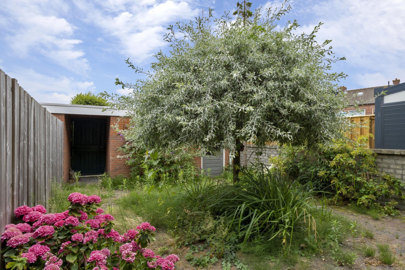Tussenwoning te koop: Dahliastraat 12, Zevenhuizen